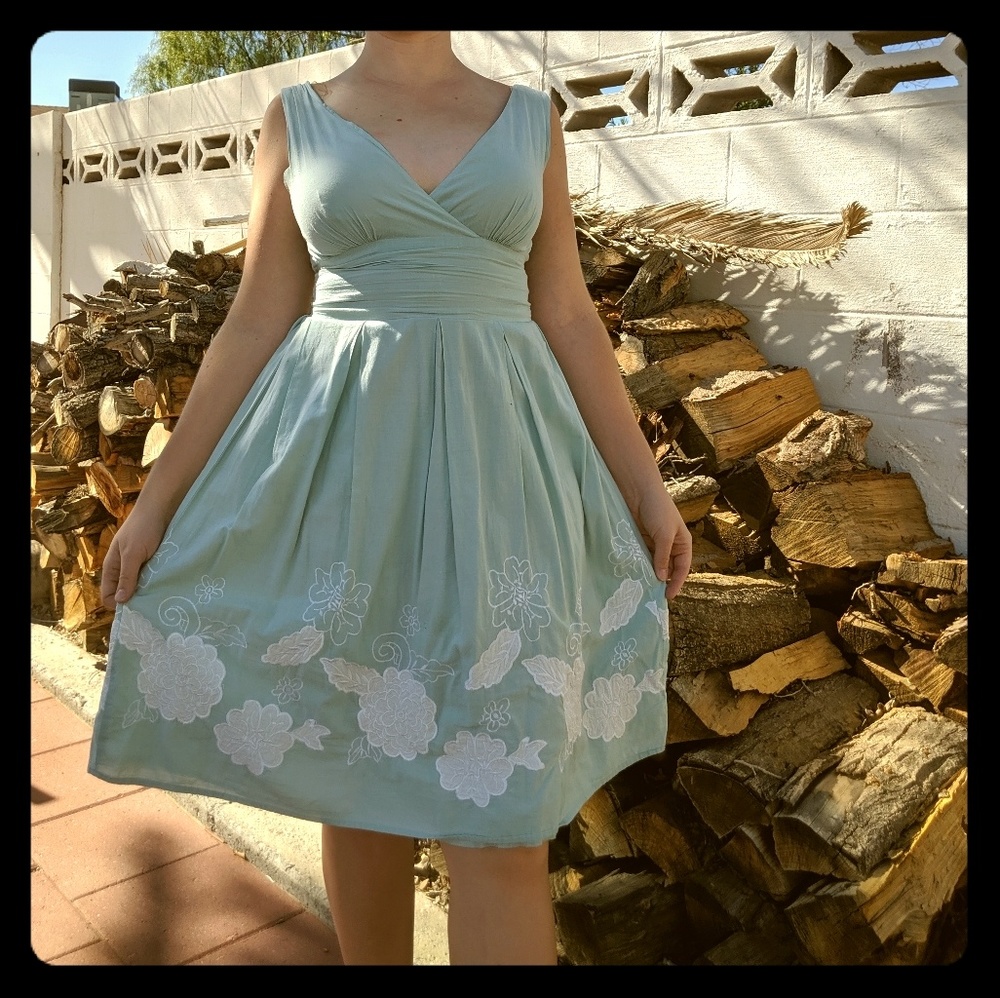 100% cotton soft blue with white flower applique